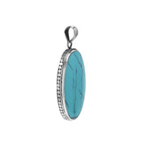 Sterling silver oval pendant with turquoise shell and hammered silver frame handcrafted in Bali